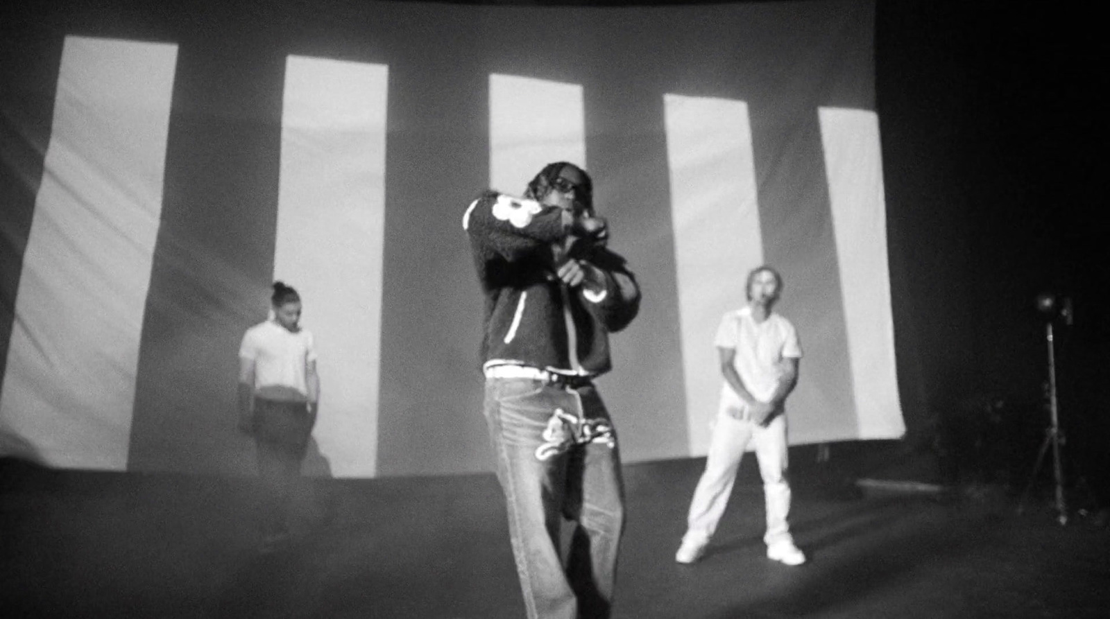 a group of men standing on top of a stage