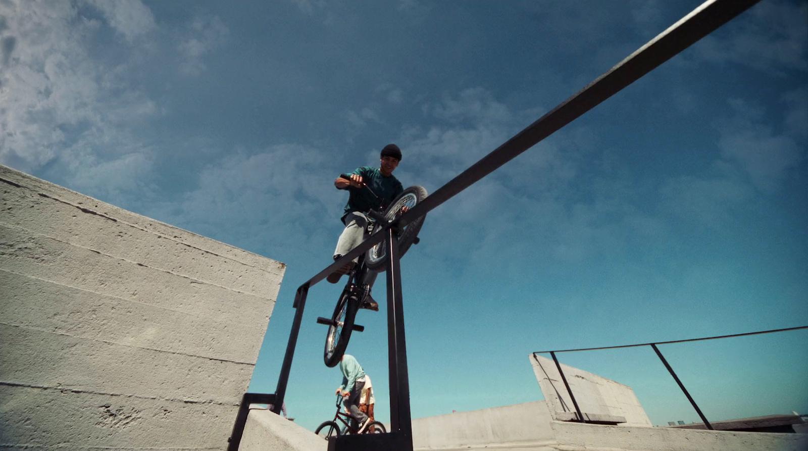 a man riding a skateboard down the side of a ramp