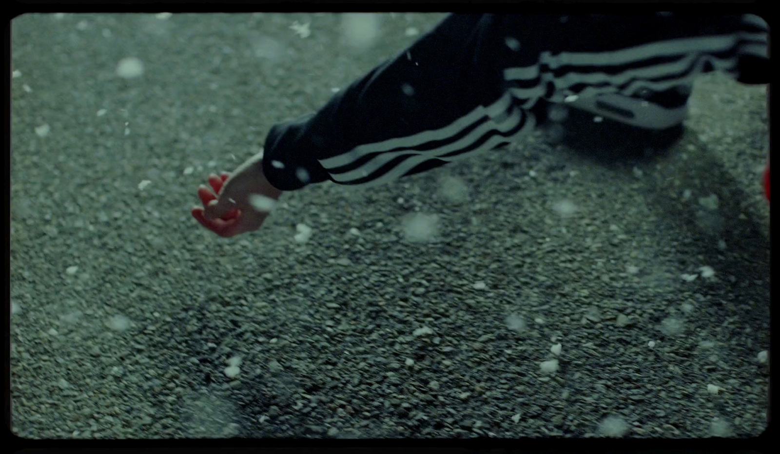 a person walking in the snow with red shoes