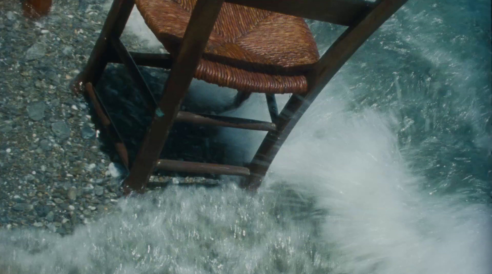 a chair that is sitting in some water