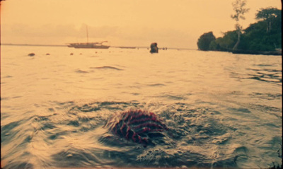 a boat is in the water near a shore