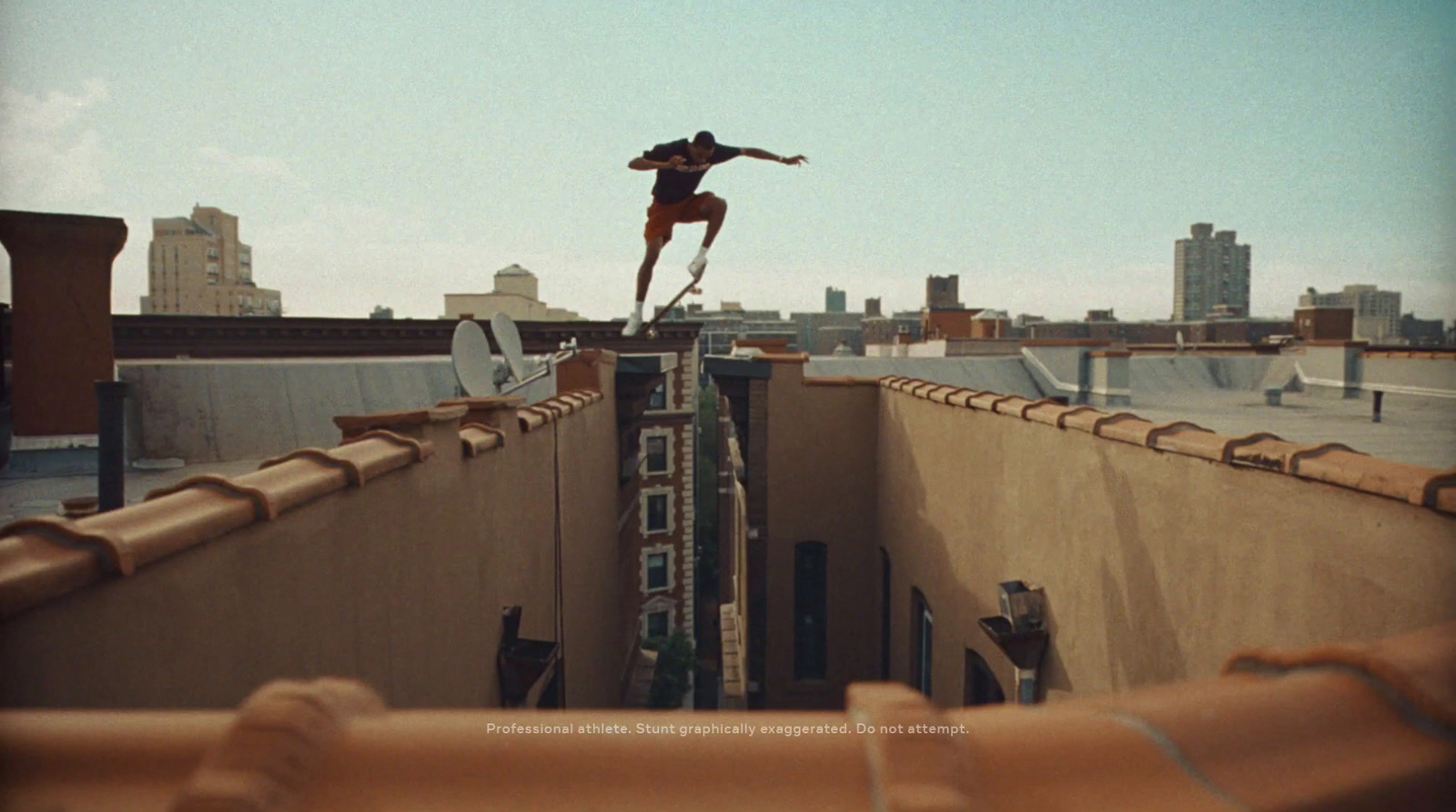 a skateboarder is doing a trick on the edge of a building