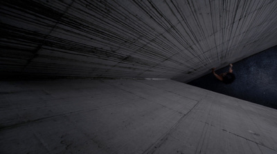 a skateboarder is going down a ramp in the dark