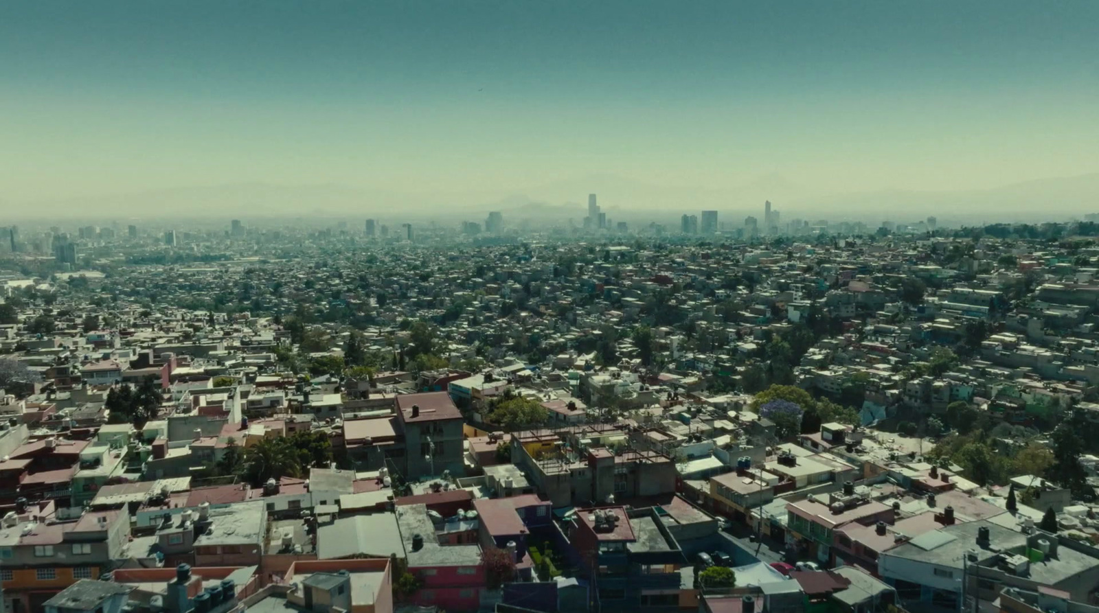 an aerial view of a city with tall buildings