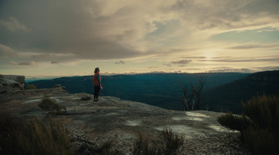 a person standing on top of a cliff