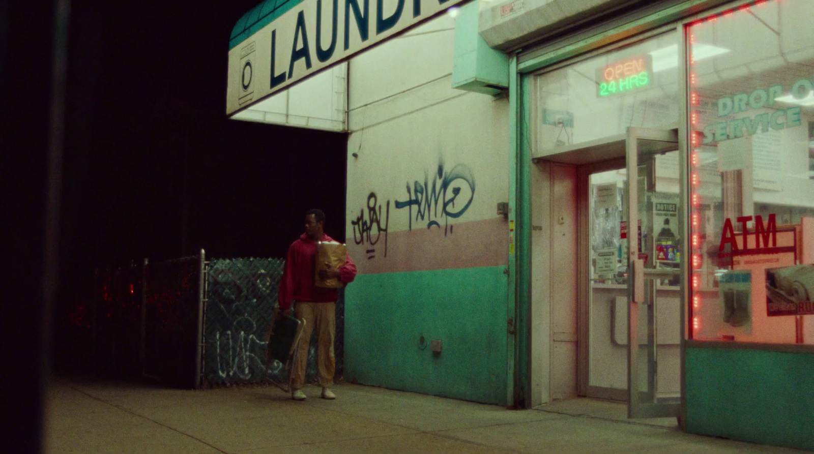 a couple of people standing outside of a building