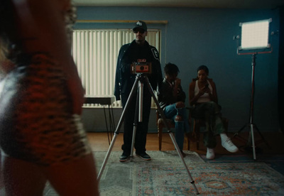 a man standing in front of a camera in a living room