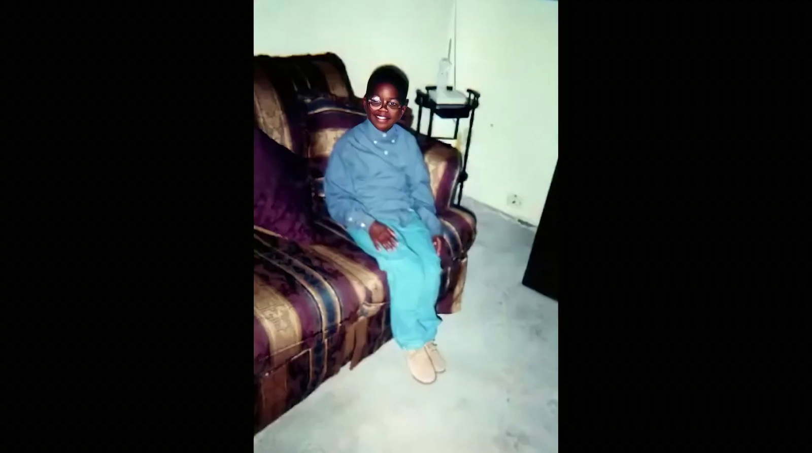 a person sitting on a couch in a room