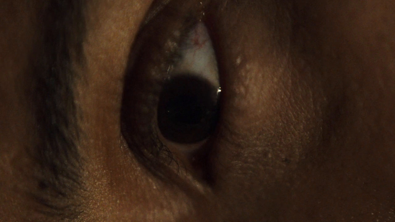 a close up of a person's eye with the iris partially closed