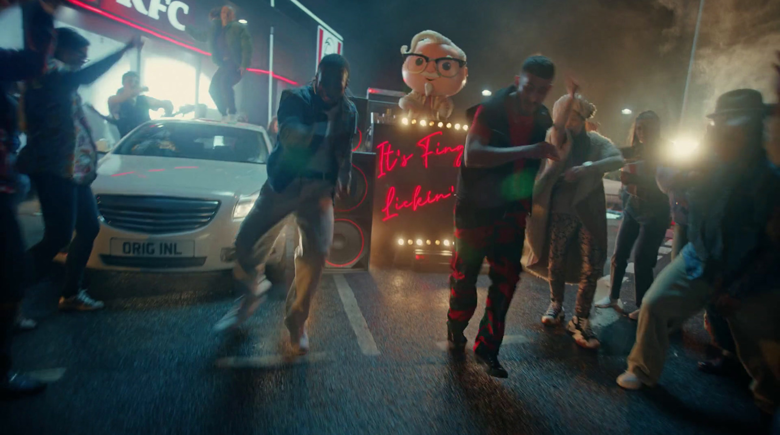 a group of people standing on the side of a road