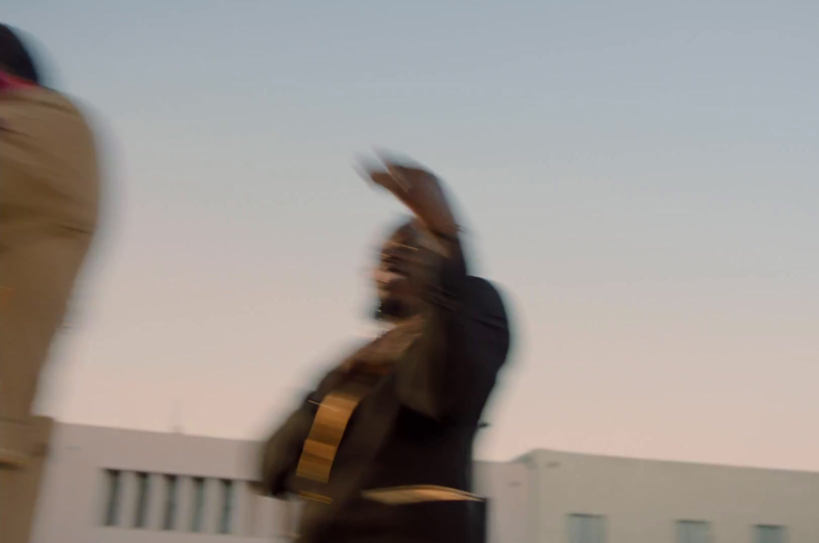 a blurry photo of a man playing a guitar