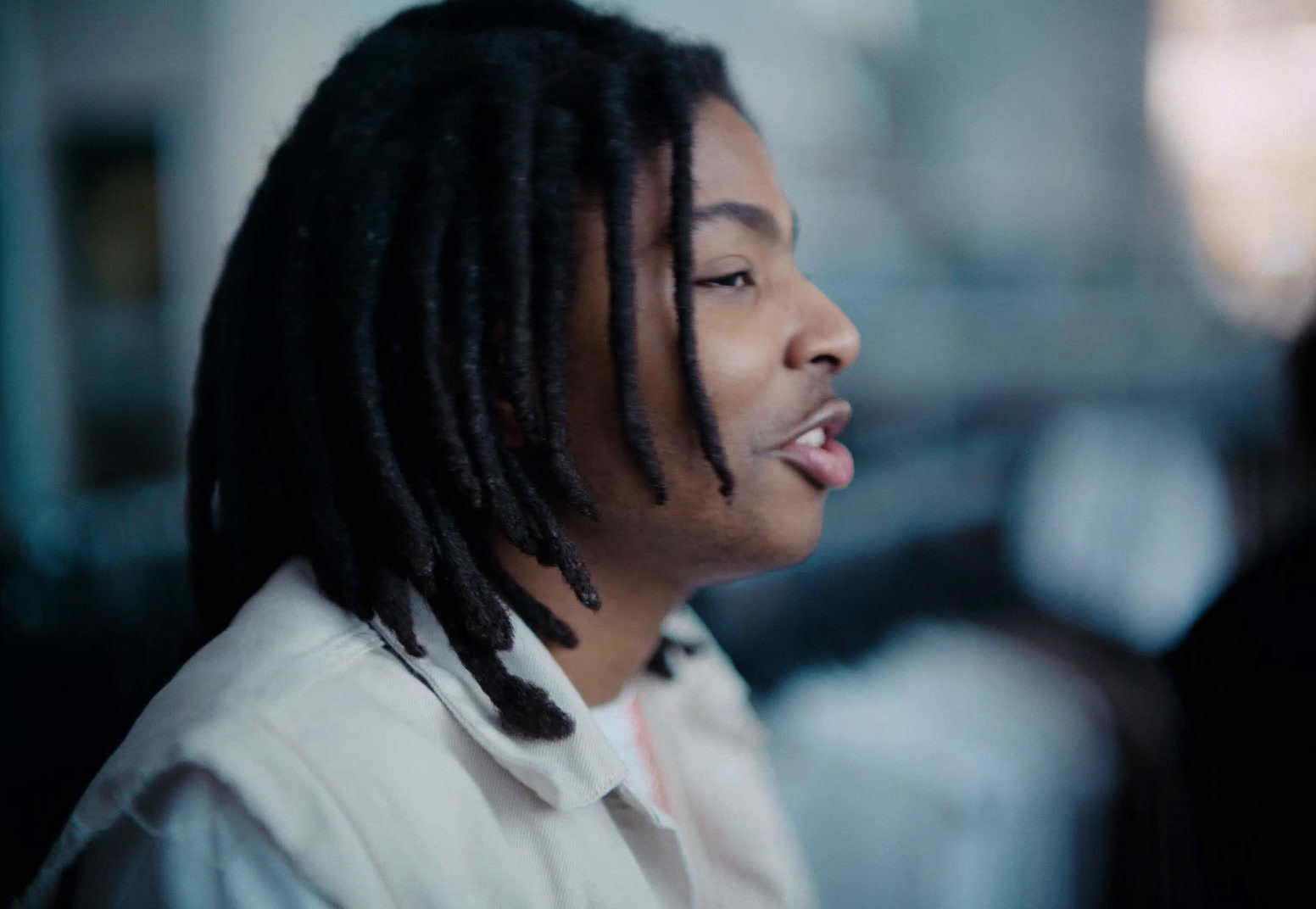 a close up of a person with dreadlocks