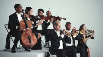 a group of men and women playing musical instruments