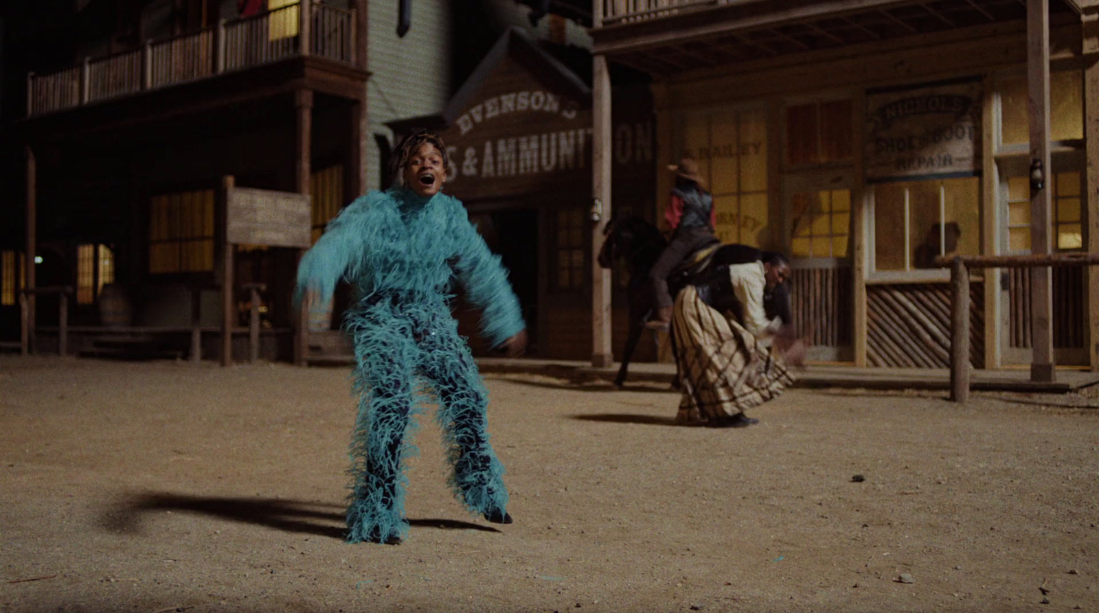 a woman in a blue costume is dancing in front of a building