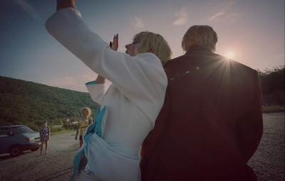 a man and woman taking a picture with a cell phone