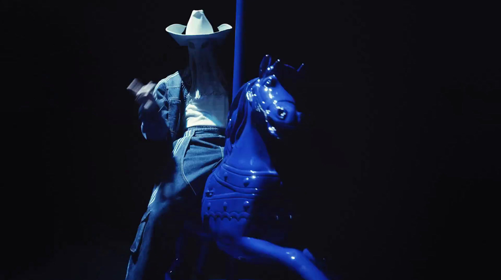 a statue of a man riding a blue horse