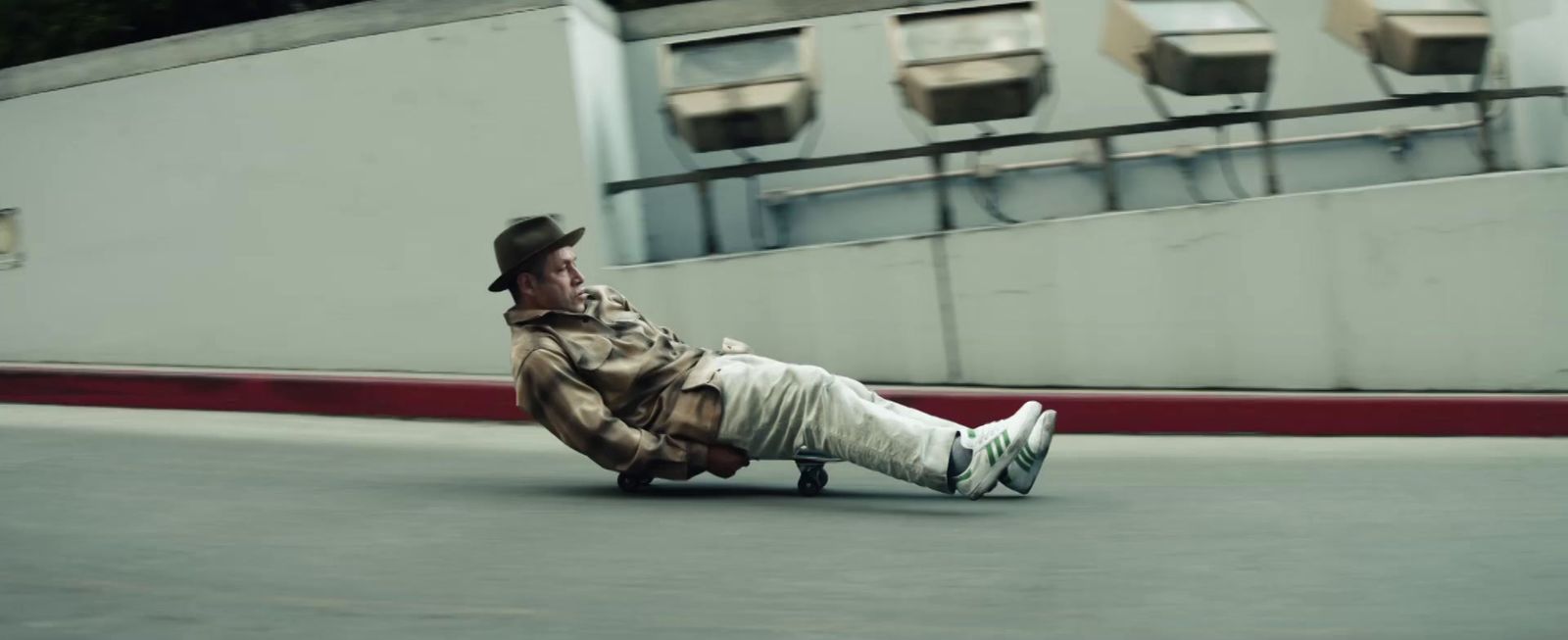 a man laying on his back on a skateboard