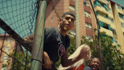 a man standing in front of a net holding a frisbee