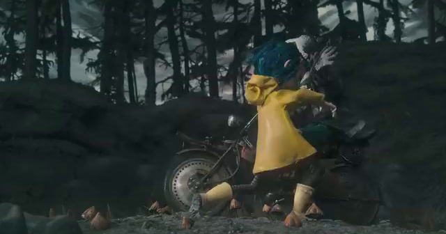 a person in a yellow raincoat riding a motorcycle