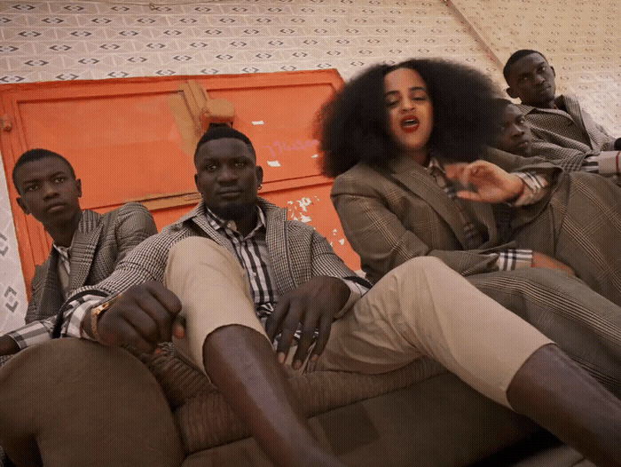 a group of people sitting on top of a couch