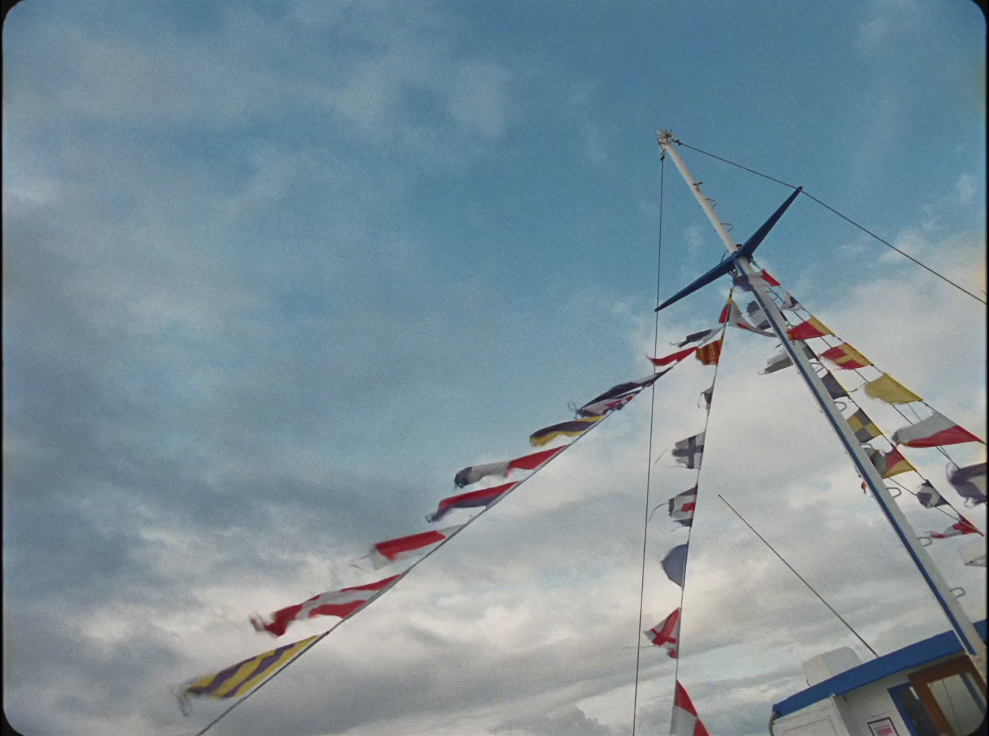 a group of flags flying in the air