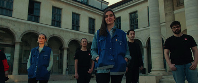 a group of people standing in front of a building