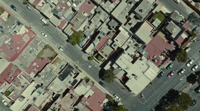 an aerial view of a city street and buildings