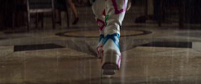 a person walking in the rain with an umbrella