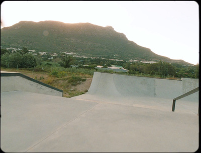 a man riding a skateboard up the side of a ramp