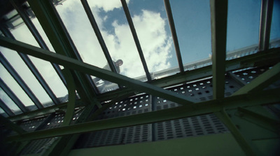 a metal structure with a sky in the background