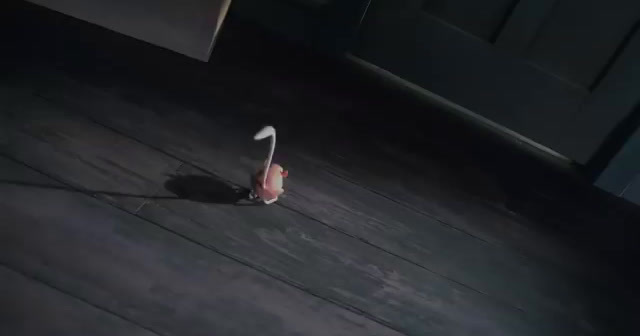 a red and white object on a wooden floor