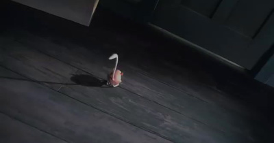 a red and white object on a wooden floor