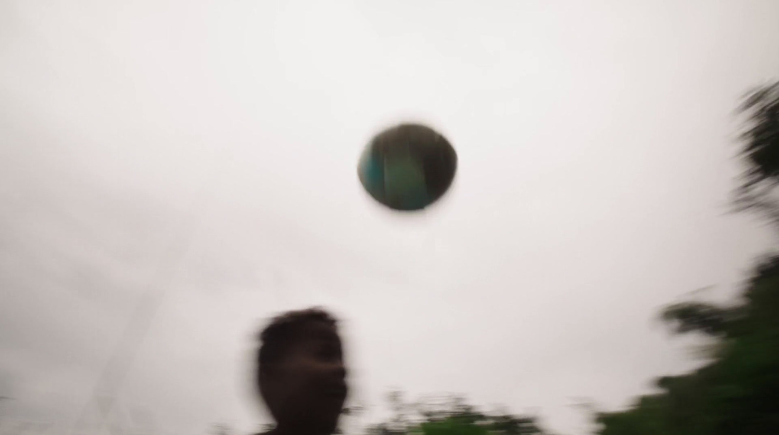 a blurry photo of a person throwing a frisbee