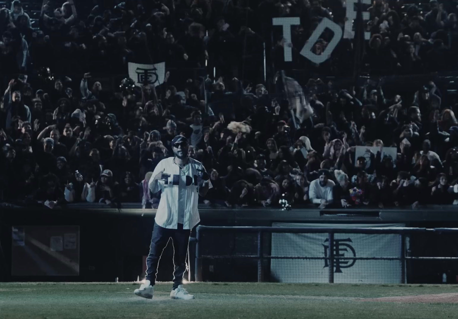 a baseball player standing on top of a field