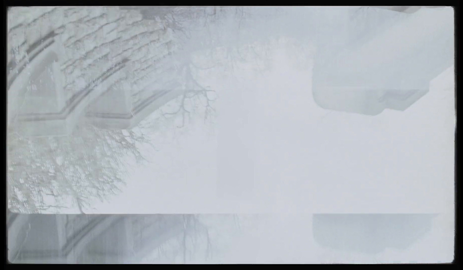 a view of a snowy street from a car window