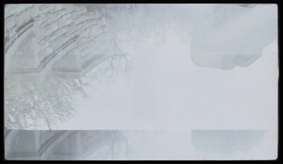 a view of a snowy street from a car window