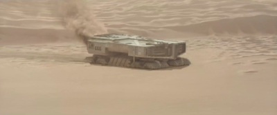 a vehicle is in the middle of a desert