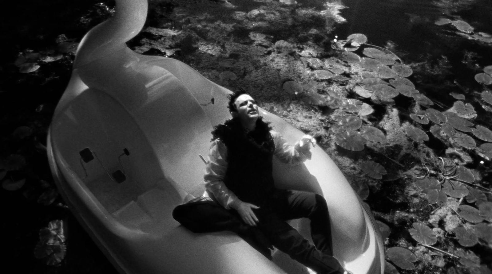 a man sitting on top of an inflatable boat