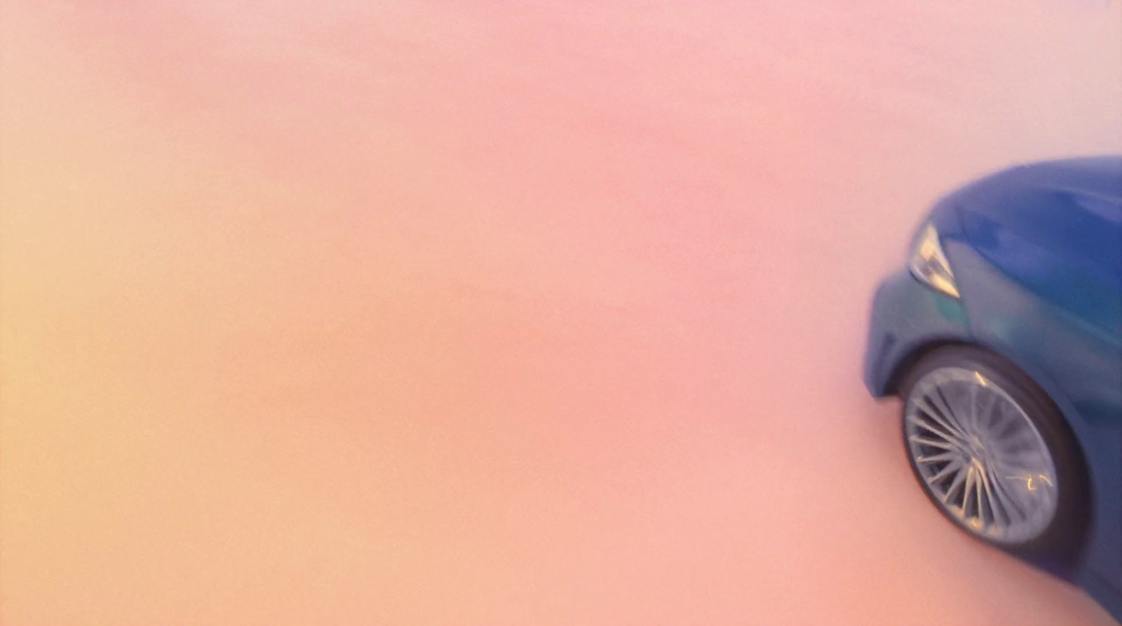 a blue toy car sitting on top of a pink floor