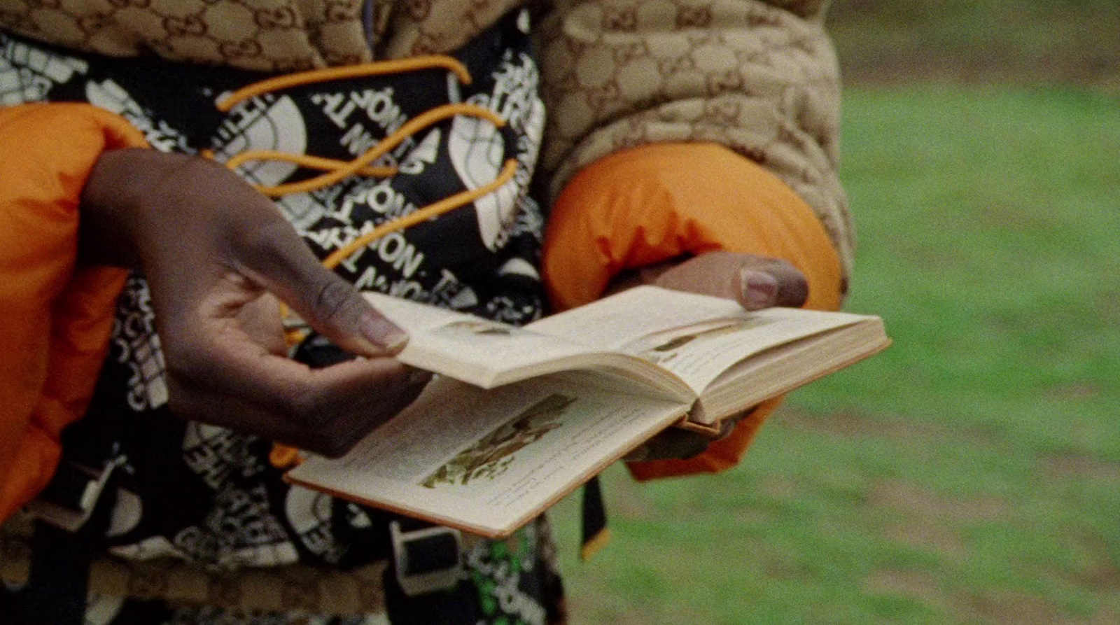 a person holding a book in their hands