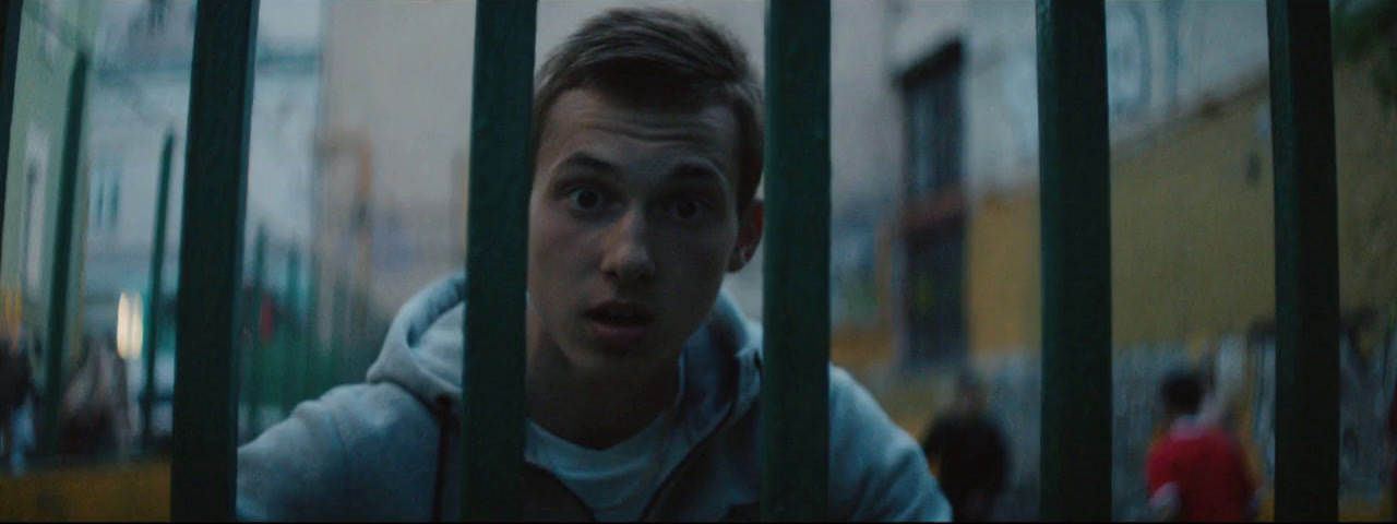 a man in a jail cell looking at the camera