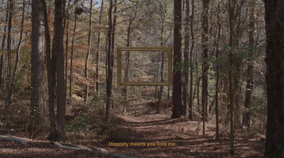 a picture frame in the middle of a forest