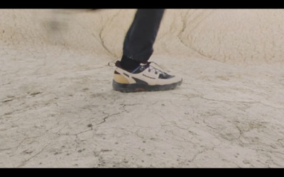 a person standing on top of a skateboard ramp