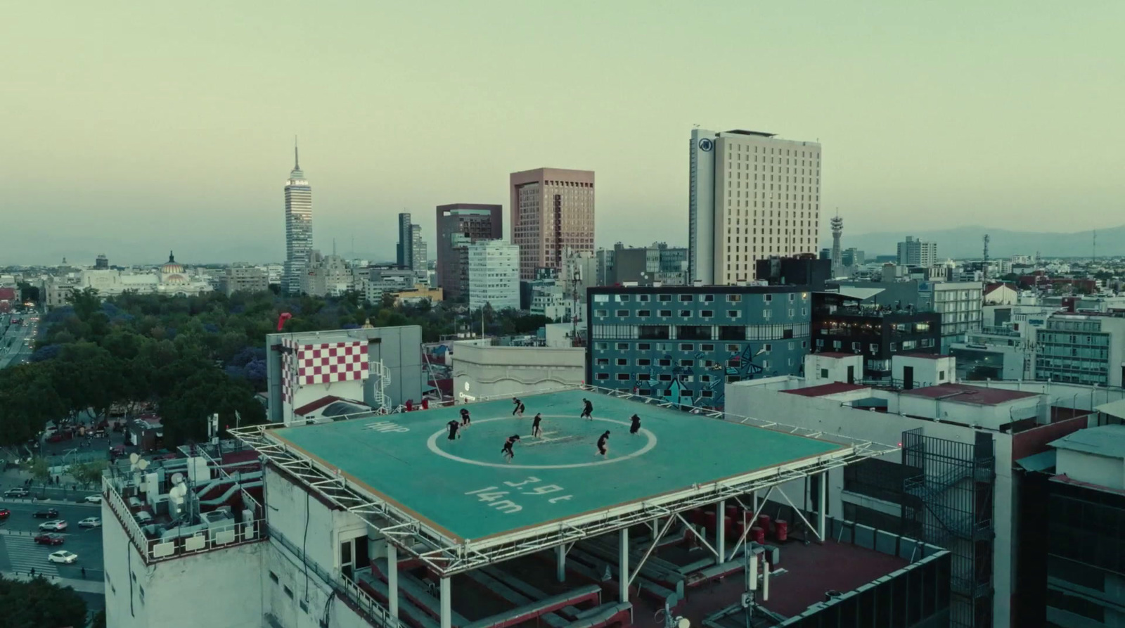 a group of people playing a game on top of a building