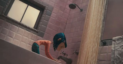 a bathroom scene with focus on the shower head