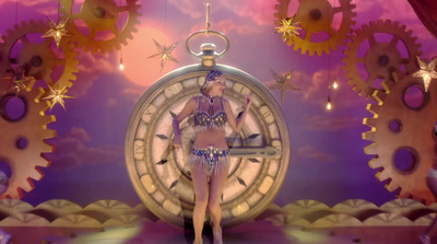 a woman standing in front of a giant clock