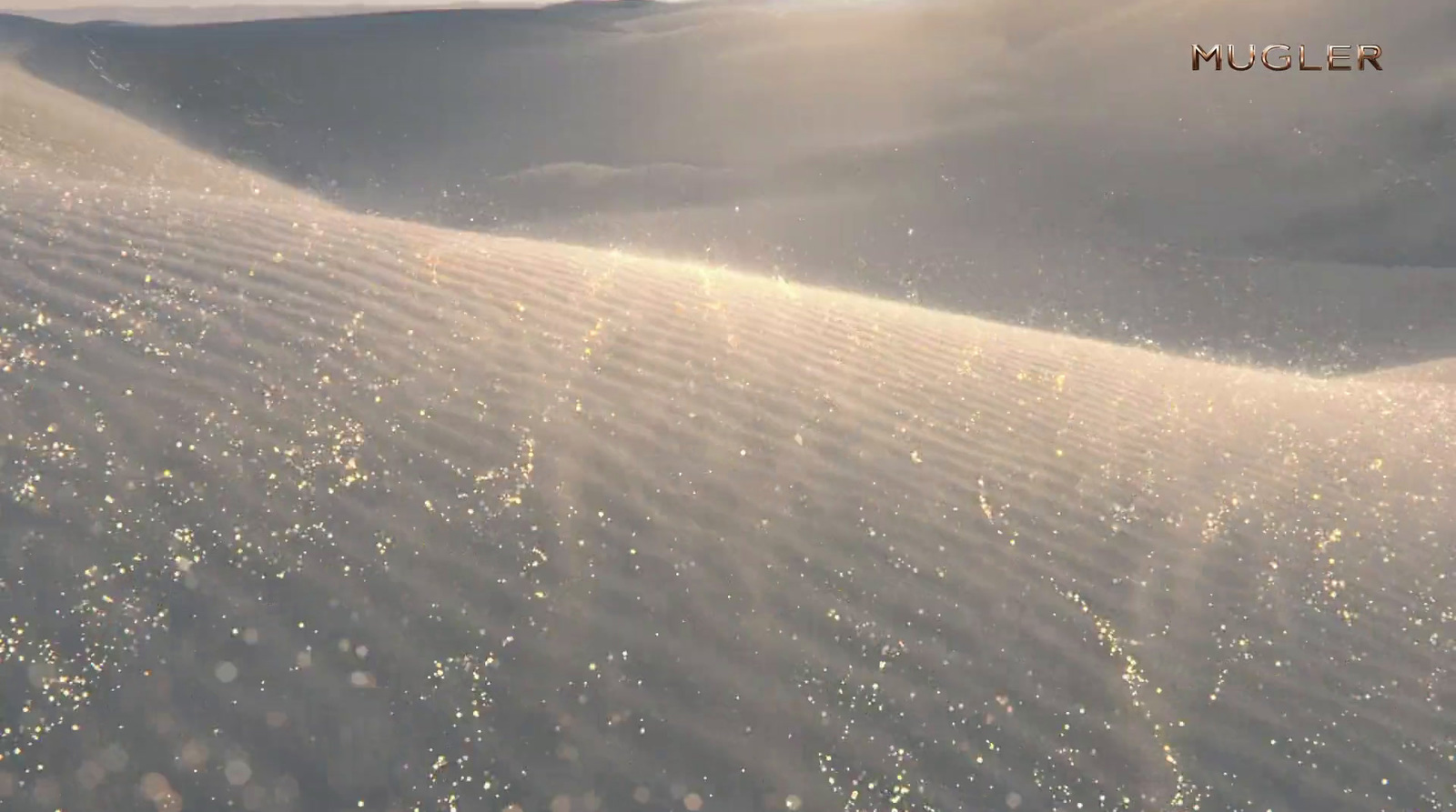 a snowboarder is going down a snowy hill