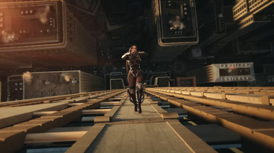 a woman in a futuristic suit is walking on a platform