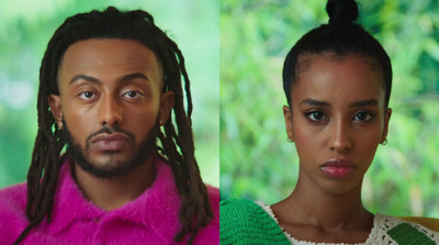 a man and a woman with dreadlocks standing next to each other