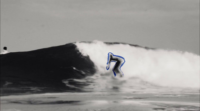 a man riding a wave on top of a surfboard